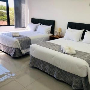 Postel nebo postele na pokoji v ubytování Hotel Luis Pablo
