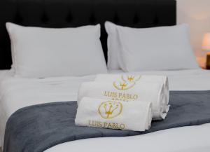 Postel nebo postele na pokoji v ubytování Hotel Luis Pablo + 1 fotografie