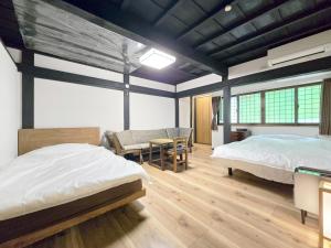 Postel nebo postele na pokoji v ubytování 一宿一景一生縁-千葉県四街道店
