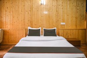 Hotel O Kaizen Residency客房内的一张或多张床位