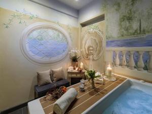 a bathroom with a large tub and a window at Apartment in Lucca near Guinigi Tower in Lucca +46 photos