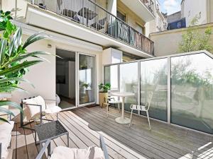 an apartment balcony with a table and chairs at Cozy Studio with Balcony 2 Guests Paris 16th in Paris