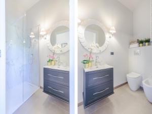 a bathroom with two sinks and a shower and a mirror at Villa in Tuscany near Lucca with Pool in Lucca +87 photos