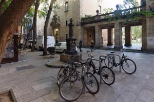 a group of bikes parked on a city street at Pensión Teruel in Barcelona