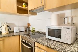 Кухня или мини-кухня в Apartament Conde Güell
