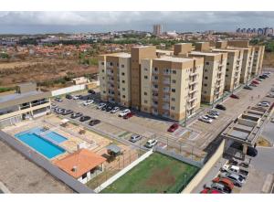 an aerial view of a parking lot with buildings at Belíssimo Apto a 2 km da Litorânea in São Luís