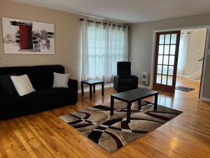 Et sittehjørne på Maison vue Fleuve 4 chambres deux pas du traversier !