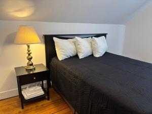 En eller flere senger på et rom på Maison vue Fleuve 4 chambres deux pas du traversier !