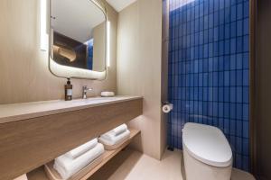 Vannituba majutusasutuses Tianjin Station Crystal Orange Hotel
