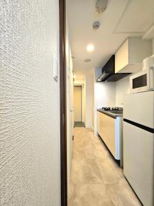 Kuchyň nebo kuchyňský kout v ubytování 嵐 Hotel Arashi Tengachaya No005
