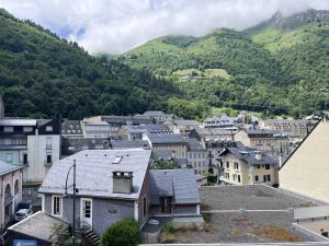 a city with houses and mountains in the background at Appartement central à Cauterets, idéal pour 5 pers, animaux admis - FR-1-812-137 in Cauterets +2 photos