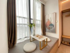 Area soggiorno di 深圳华尔曼欢朋酒店公寓 罗湖水贝珠 宝城店
