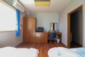 Postel nebo postele na pokoji v ubytování Hotel NALU　ホテルナル