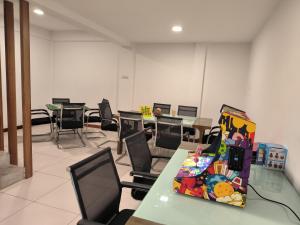 a classroom with tables and chairs in a room at Deco Home Mesilau Golf Bungalow Kundasang in Kundasang