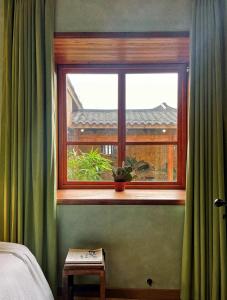 Postel nebo postele na pokoji v ubytování Yunzhu Healing Boutique B&B