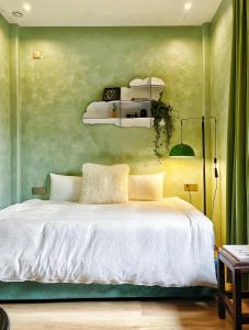 Postel nebo postele na pokoji v ubytování Yunzhu Healing Boutique B&B