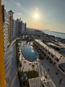 a view of a beach with a pool and buildings at porto marina resort challet in El Alamein