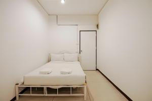 Ένα ή περισσότερα κρεβάτια σε δωμάτιο στο X GO INN Asiatique Bangkok - โกอินน์ เอเชียทีค เจริญกรุง +25 φωτογραφίες