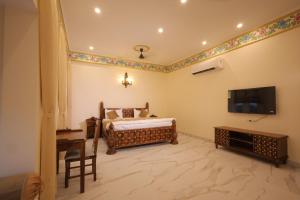 Et tv og/eller underholdning på Agastya Vilas Resort