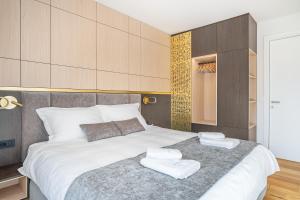 Katil atau katil-katil dalam bilik di West Alpine Apartment SKI in&out