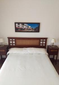 Кровать или кровати в номере Apartamentos Milenio