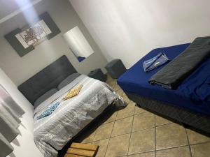 En eller flere senge i et værelse på Hostel Anprado # 8 + 2 billeder