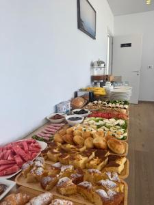 a buffet of different types of food on a table at Otto Hotel in Ksamil
