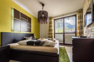 Posteľ alebo postele v izbe v ubytovaní Apartment Vanessa - Tatranská Lomnica