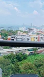 a view of a city with buildings and a highway at Condo Sea view Beach U14 in Pattaya South +1 photo