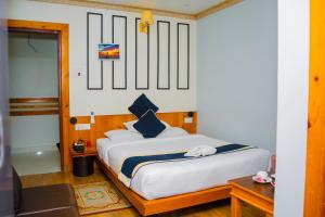 Postel nebo postele na pokoji v ubytování Hotel Gunja