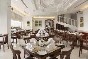 A restaurant or other place to eat at Ramada by Wyndham Beach Hotel Ajman
