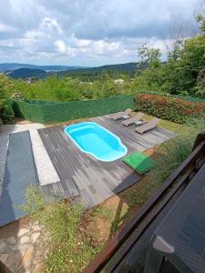 a swimming pool sitting on top of a wooden deck at ME-GA Glamping in Sapanca +32 photos