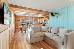 a living room with a couch and a table at 7147 - Geri's Place #11A in Wanchese