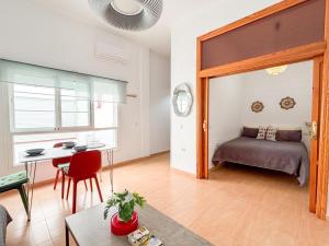 Posteľ alebo postele v izbe v ubytovaní Plz de la Merced Apartamentos Solera