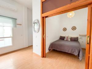 Posteľ alebo postele v izbe v ubytovaní Plz de la Merced Apartamentos Solera