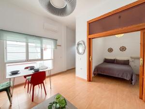 Posteľ alebo postele v izbe v ubytovaní Plz de la Merced Apartamentos Solera