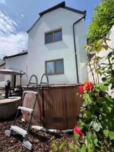 a house with a shopping cart in front of it at Chalupa Veselí in Veselí nad Moravou