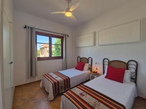 two beds in a room with a window at Villa Florida in Motril +27 photos