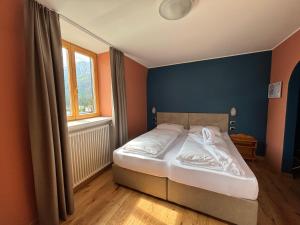 Postel nebo postele na pokoji v ubytování Hotel Savoia
