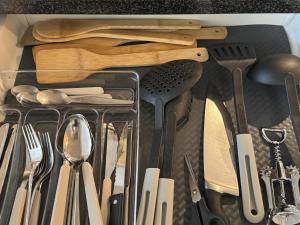 a drawer filled with lots of kitchen utensils at Fribourg Home in Fribourg