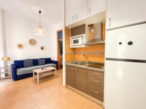 Kuchyňa alebo kuchynka v ubytovaní Plz de la Merced Apartamentos Solera