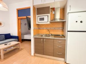 Kuchyňa alebo kuchynka v ubytovaní Plz de la Merced Apartamentos Solera