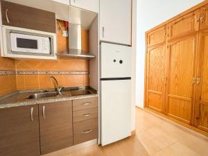 Kuchyňa alebo kuchynka v ubytovaní Plz de la Merced Apartamentos Solera