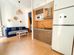 Kuchyňa alebo kuchynka v ubytovaní Plz de la Merced Apartamentos Solera