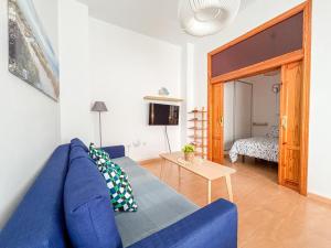 Posteľ alebo postele v izbe v ubytovaní Plz de la Merced Apartamentos Solera