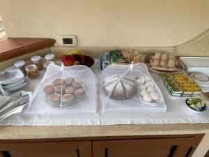 a table with a bunch of different types of food at B&B da Miranna in Dorgali +39 photos