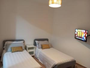 Ένα ή περισσότερα κρεβάτια σε δωμάτιο στο Lizard Hotel