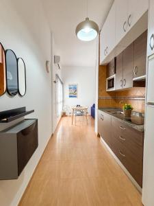Kuchyňa alebo kuchynka v ubytovaní Plz de la Merced Apartamentos Solera