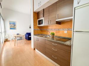 Kuchyňa alebo kuchynka v ubytovaní Plz de la Merced Apartamentos Solera