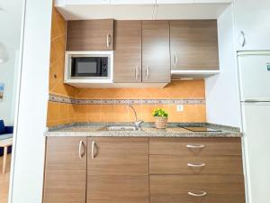Kuchyňa alebo kuchynka v ubytovaní Plz de la Merced Apartamentos Solera